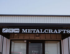 Metalcrafts sign above shop door