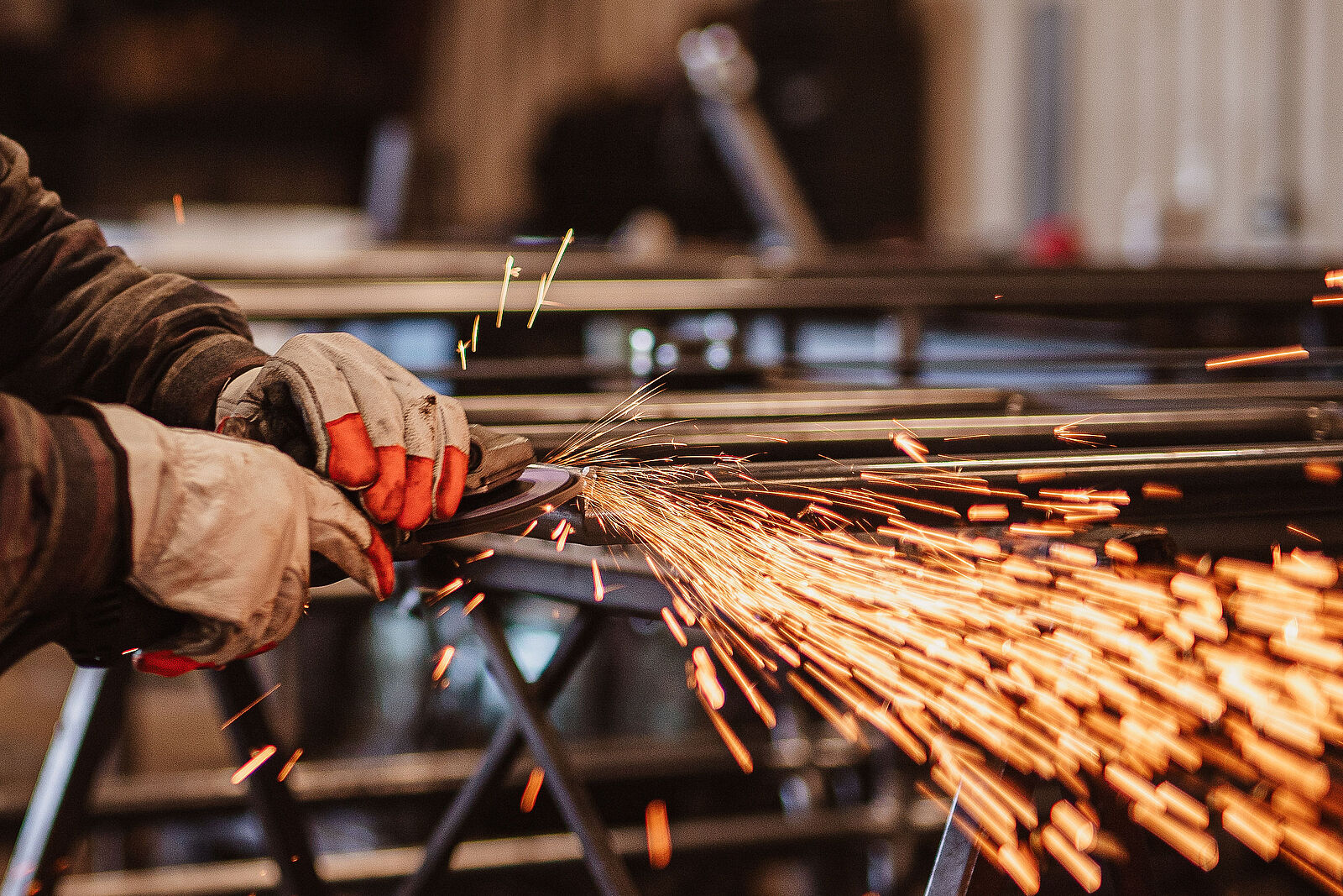 closeup of man's gloved hands welding